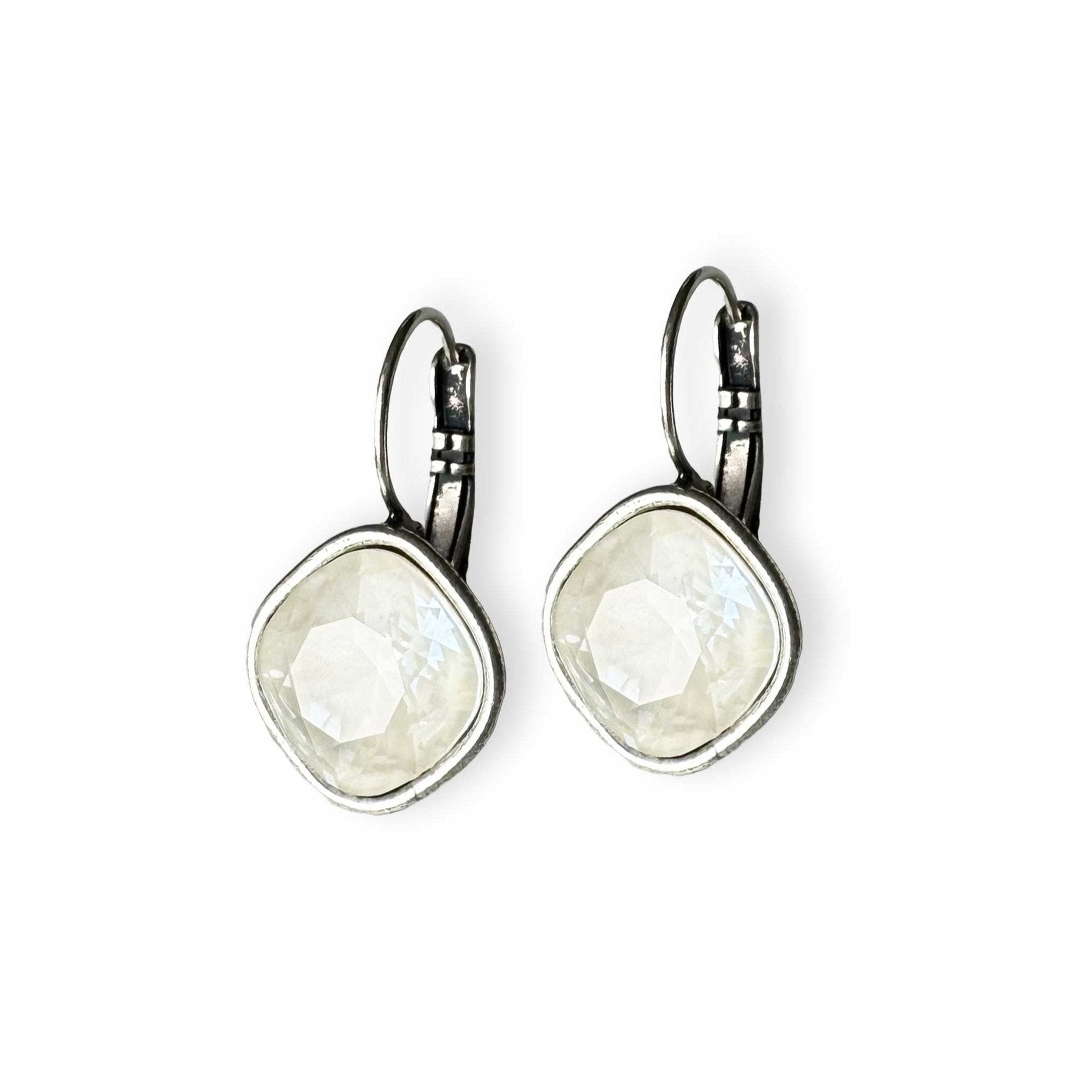 White drop earrings shown in silver.